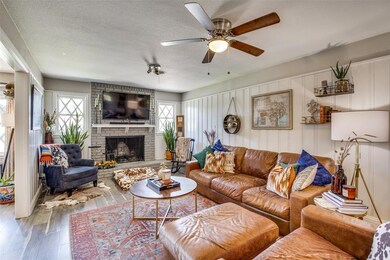 The living room features original wainscoting pane