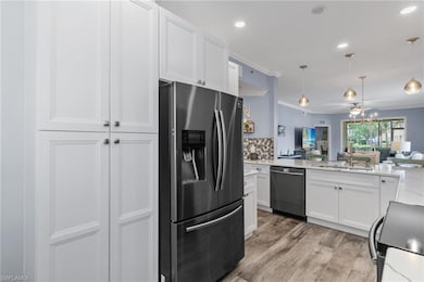 Kitchen featuring pendant lighting, sink, dishwash