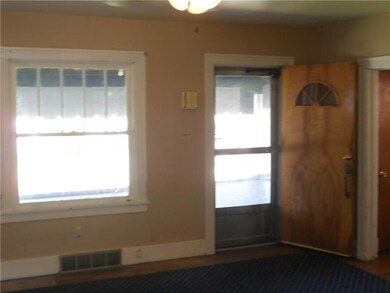 Large living room with hardwood floors refinished 