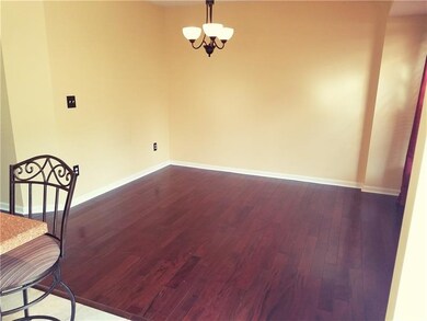 Open floor plan with beautiful hardwood flooring t