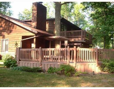 Exterior Front. Rear of home w/two decks