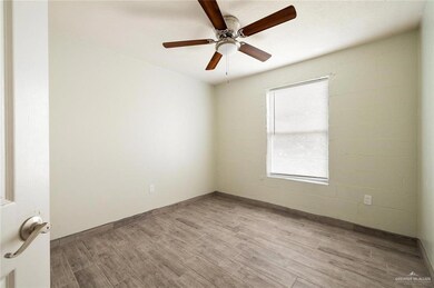 Spare room featuring hardwood / wood-style flooring and ceiling fan
