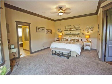 Large master bedroom. Notice tiled, walk-in shower