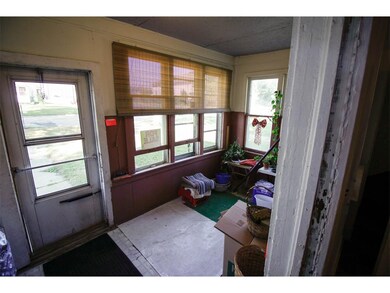 Enclosed front porch.