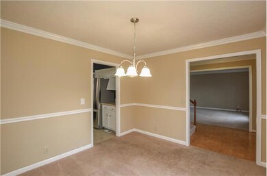 The formal dining room is to the left of the entry area