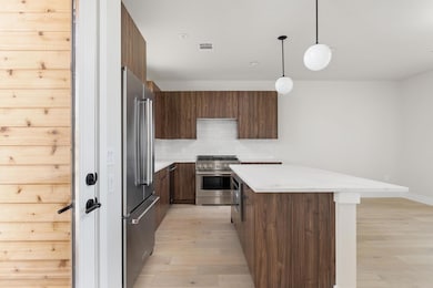 Kitchen featuring tasteful backsplash, a kitchen 