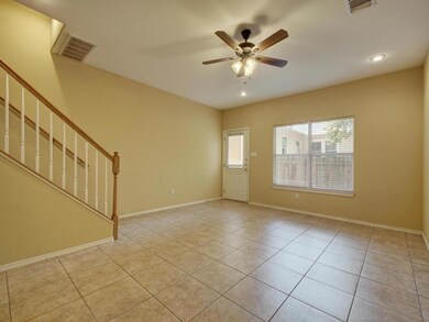 Empty room with light tile patterned flooring, recessed lighting, stairs, and a ceiling fan