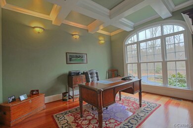 Large office with coffered beam ceiling, sconce fi