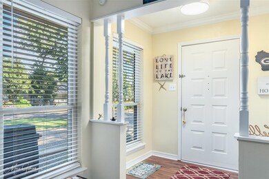 Entrance foyer with ornamental molding, hardwood /