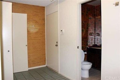 Front door, closets and the guest bathroom