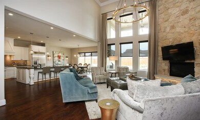 Open concept floorplan from kitchen to living.  ALL WINDOW SHADES THROUGHOUT THE HOME ARE AUTOMATED (electronically operated)