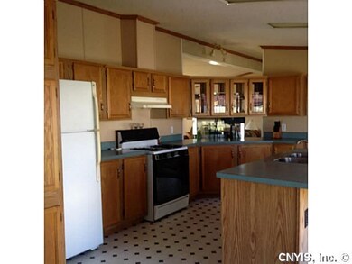 Kitchen. Kitchen has breakfast area, wall of pantr