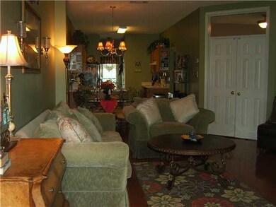 Greatroom with hardwood floors open to dining area