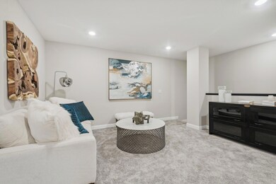 (Photo of a decorated model, actual homes finishes will vary) A loft located at the top of the stairs that could be a sitting area or a game room!