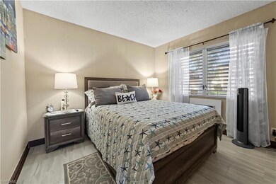 Bedroom with a textured ceiling