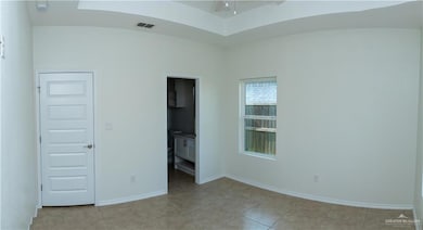 Unfurnished bedroom featuring baseboards, visible vents, and light tile patterned flooring