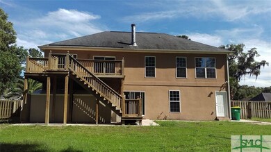 Full back view showing 2 storage units under deck.