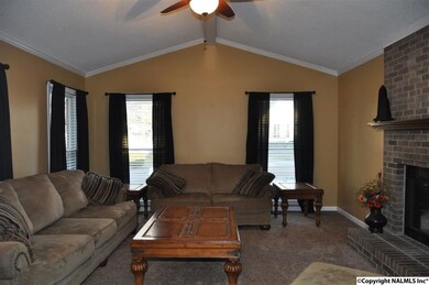 You can certainly see that large furniture has NO problem fitting beautifully here ! The Vaulted ceiling gives this an even more generous feel. Warm your toes by the fireplace , kick back and watch some TV !