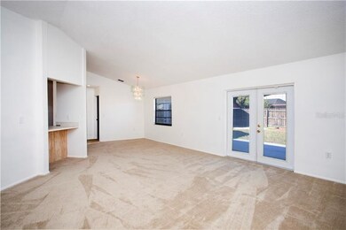 View of back yard through French doors that open u