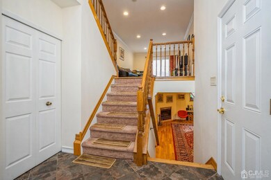 foyer with half bath, garage access, coat closet.