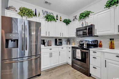 Kitchen featuring ornamental molding, backsplash, 