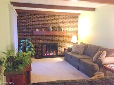 Living Room features gas burning fireplace.