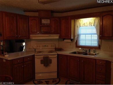 plenty of cabinets in an eat in kitchen