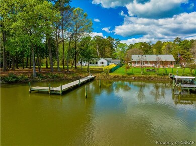 Back yard of home with pier on Horn Harbor