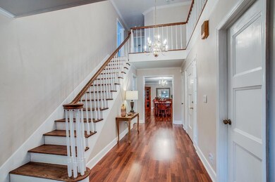 Beautiful wood staircase with overlooking balcony.