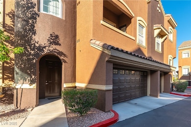 View of building exterior with a garage