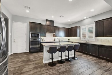 Kitchen with a breakfast bar area, stainless steel