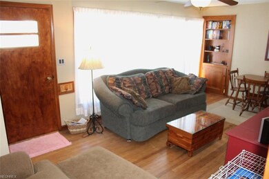 The living room has a huge picture window allowing