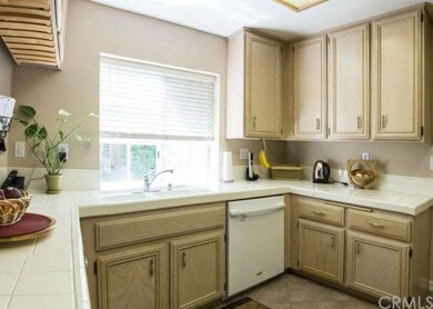 Light and bright kitchen with hanging wine rack an