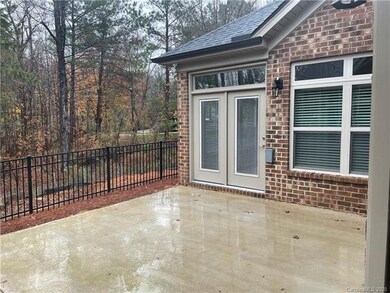 Fenced in Courtyard on end wooded lot. Maintenance