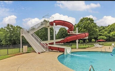 View of swimming pool featuring a water slide and 