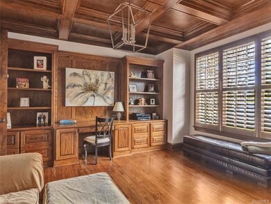 Executive study with coffer ceilings, hardwood flo