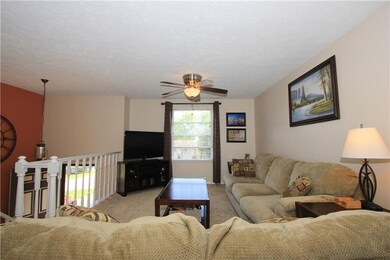 The formal living room is adjacent to the dining r