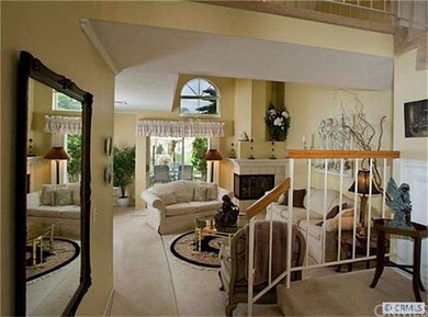 Living room with fireplace. Patio area