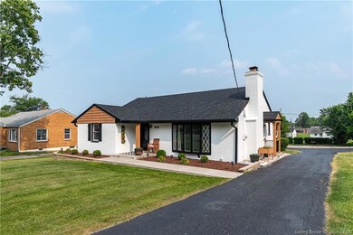 Freshly paved driveway leads to detached garage!