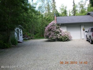 Lilac tree by garage