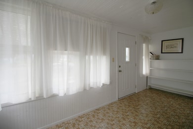 Inviting enclosed front porch