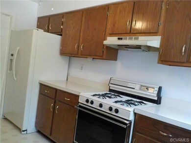 Kitchen with gas cooking and side by side refriger