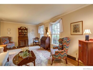 The formal living room features hardwood flooring 