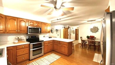 Kitchen with custom cabinets, newer stainless stee
