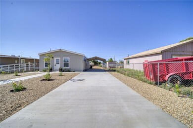 View of side of home featuring a detached carport