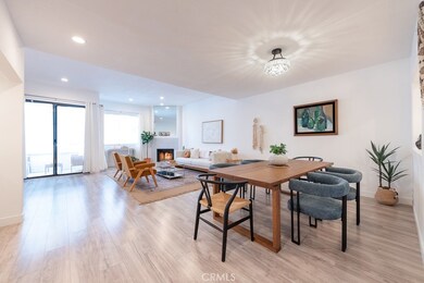 Living Room with Fireplace and Balcony plus Dining area