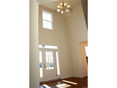 Dramatic 2 story foyer.