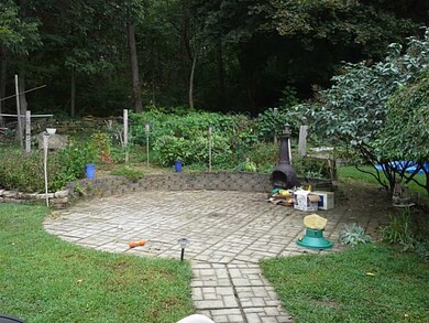 Patio/Deck. Flower and vegetable gardens.