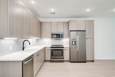 Kitchen with stainless steel appliances, a sink, 