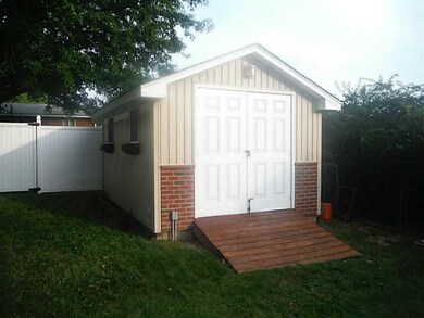 Storage. Custom built shed matches the house.